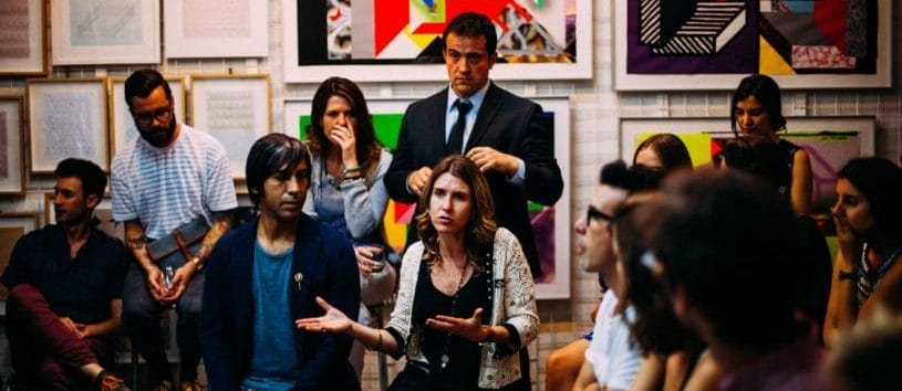 CCHST team talking at a meeting. Learn more about our approach today.